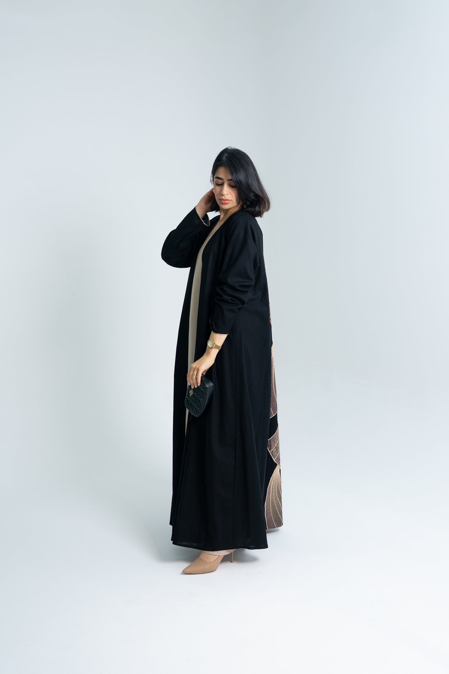 A cut Linen abaya with gold hand embroidery at the back