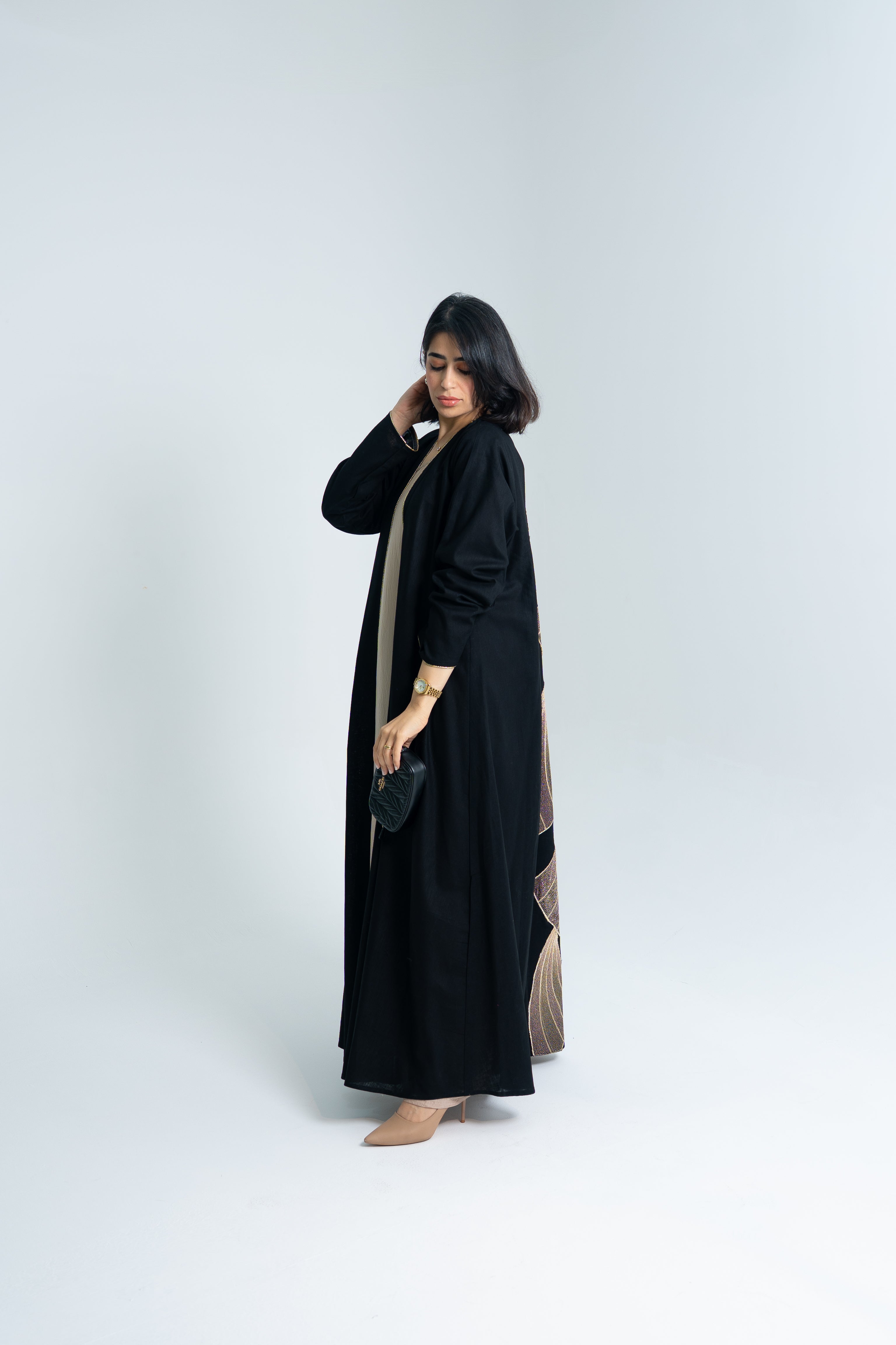 A cut Linen abaya with gold hand embroidery at the back